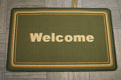 green welcome mat
